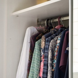 a closet with clothes