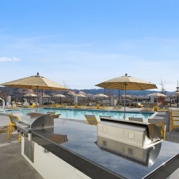 a grill area near a pool