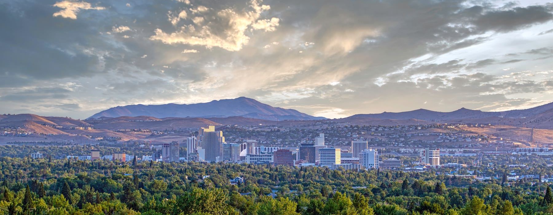 a city with mountains in the background