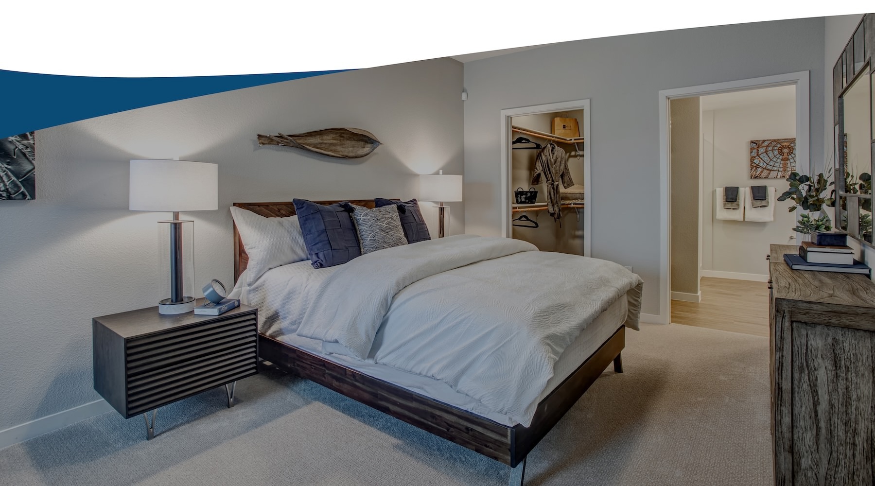 a bedroom with a bed and two nightstands